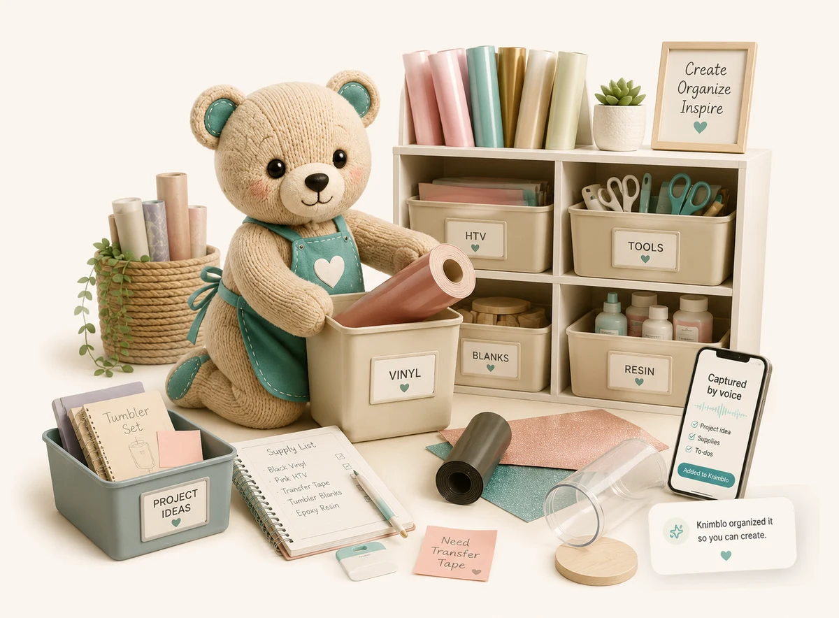 Knimblo the bear in an apron organizing craft supplies into labeled bins, beside a supply list, vinyl rolls, and a phone capturing a voice note